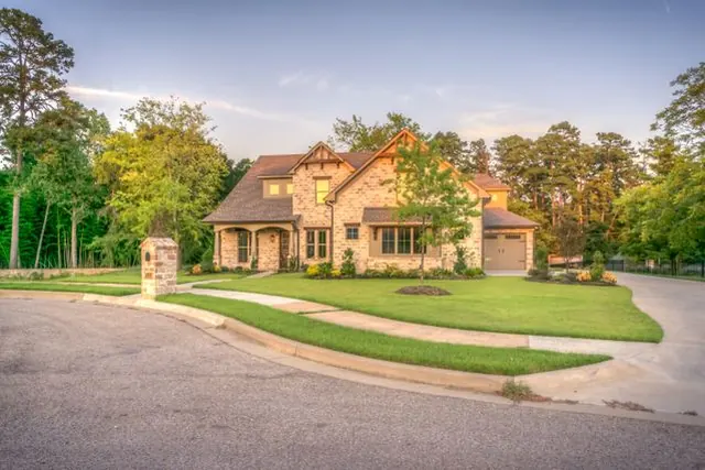 A suburban San Diego home with a clear driveway after a residential cleanout